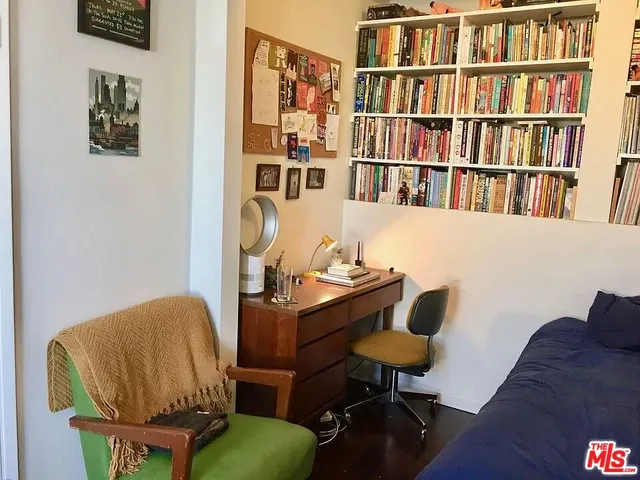 a kitchen with a refrigerator and a stove