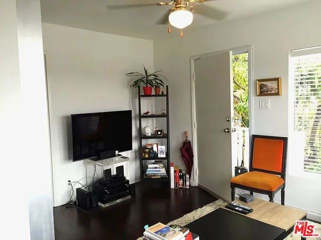 a kitchen with white cabinets and a stove