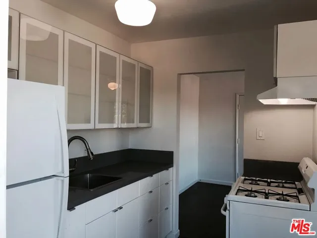 a bedroom with a bed and a cabinets