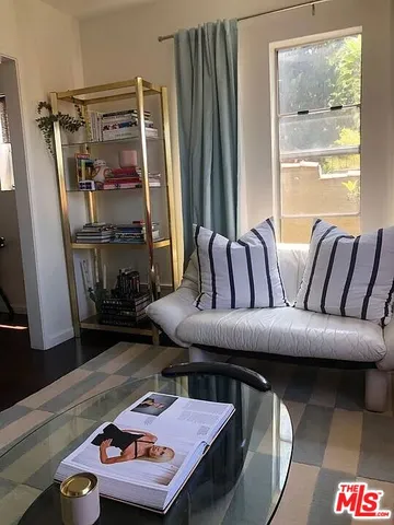 a bed room with a bed and a chair