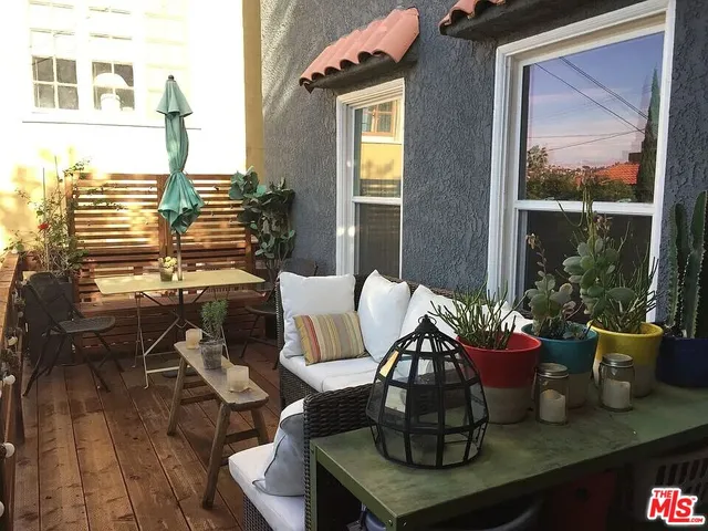 a view of balcony with wooden floor