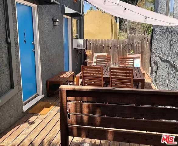 a kitchen with a sink and wooden floor