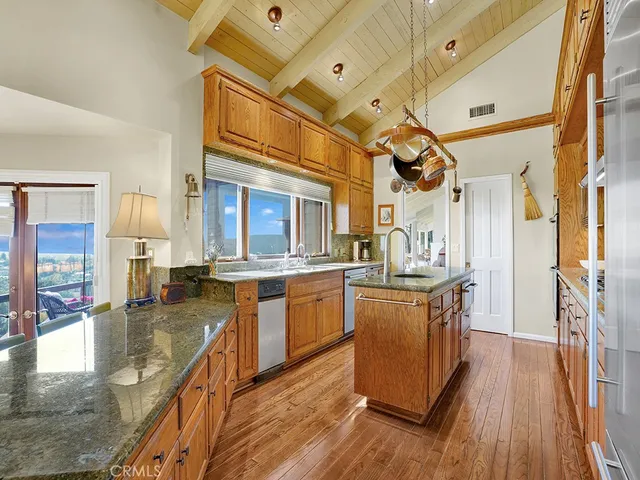 a view of a dining room with furniture and a chandelier