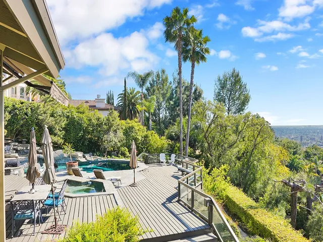 a room with lots of wooden furniture and a bath tub