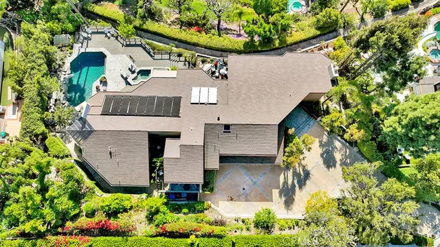 an aerial view of a house with a garden