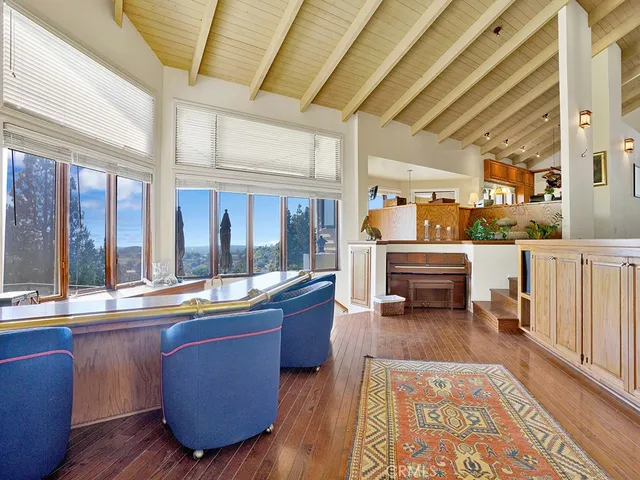 a view of swimming pool with outdoor seating and plants