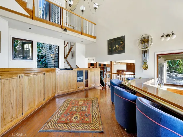 a view of a dinning table and chairs on the roof deck