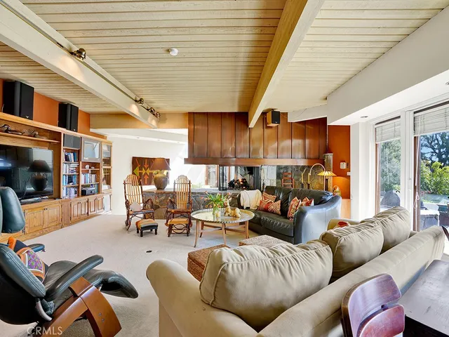 a view of a chairs and table in a backyard