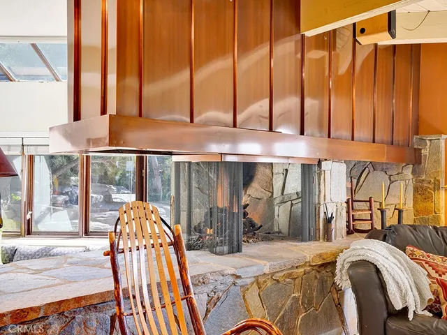 a view of a lake with lots of trees and boats