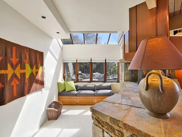 a view of a swimming pool with a yard and furniture