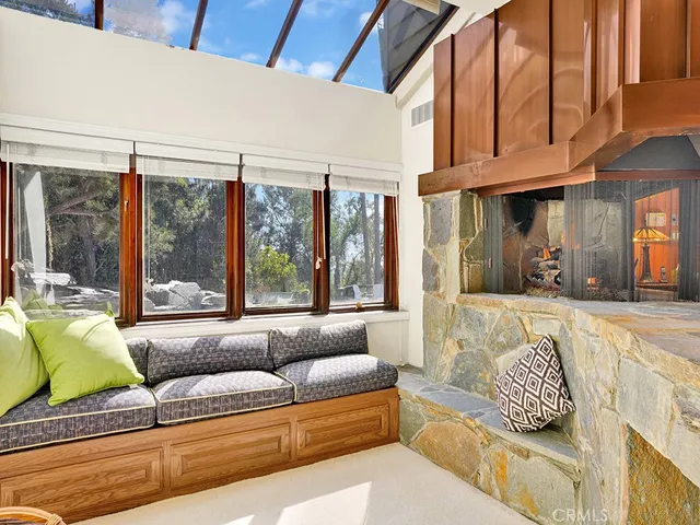 a view of a patio with table and chairs and potted plants