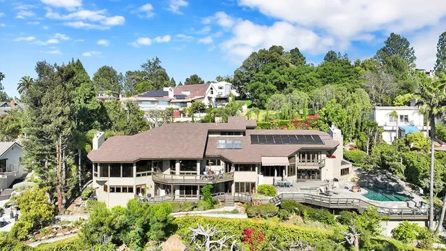 an aerial view of a house with a garden and plants