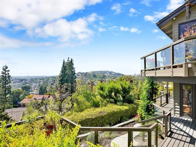 a bedroom with a large bed and a large window