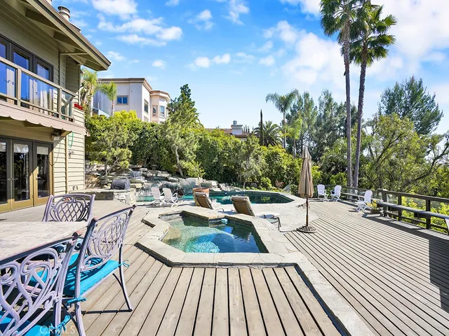 a outdoor living space with furniture and city view