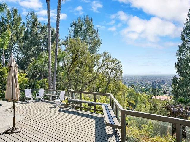 a bedroom with a bed and a lamp next to a window