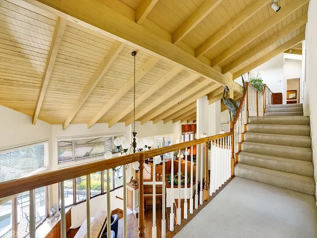 a view of a house with a small yard