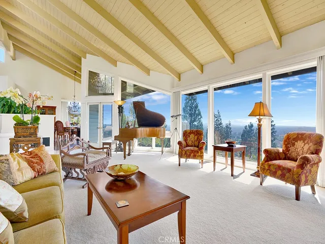 a view of a dining room with furniture wooden floor and chandelier