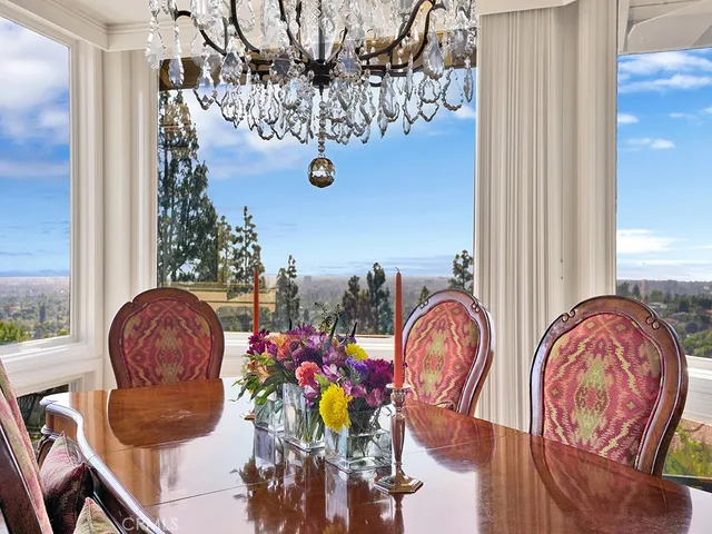 a spacious bathroom with a granite countertop sink and a large mirror