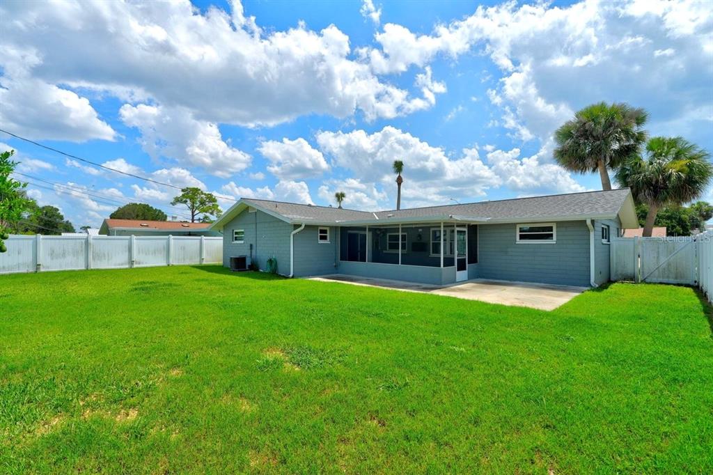 1309 Suwanee Road Daytona Beach, FL 32114 - Photo 24 of 33 a front view of a house with a garden