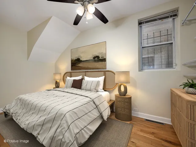 a bedroom with bed and window