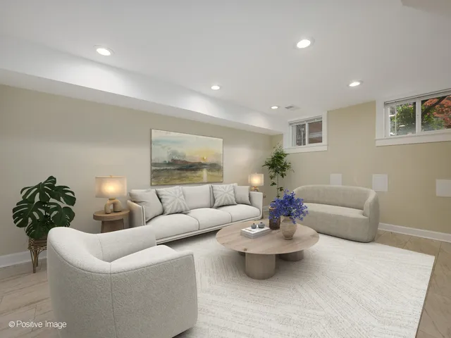 a living room with furniture and a lamp