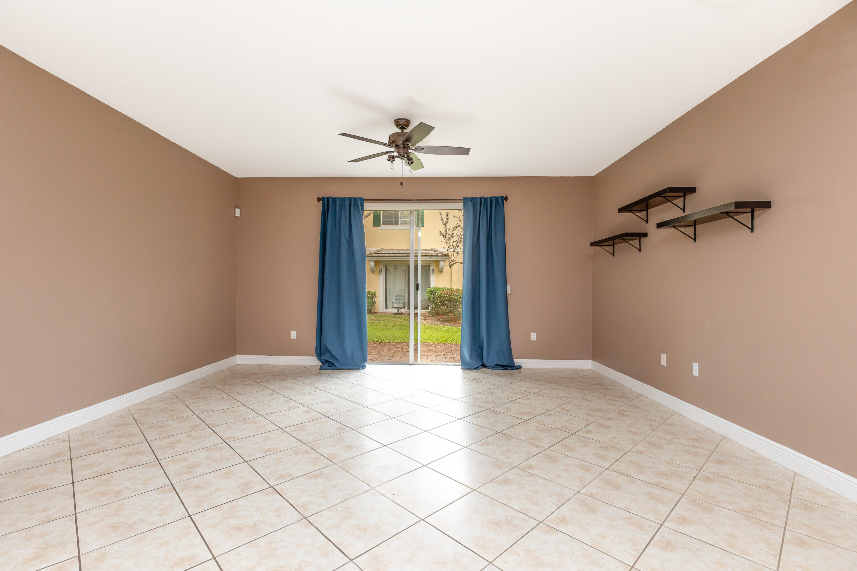 7782 Paddock Place Davie, FL 33328 - Photo 16 of 40 a view of an empty room with a window