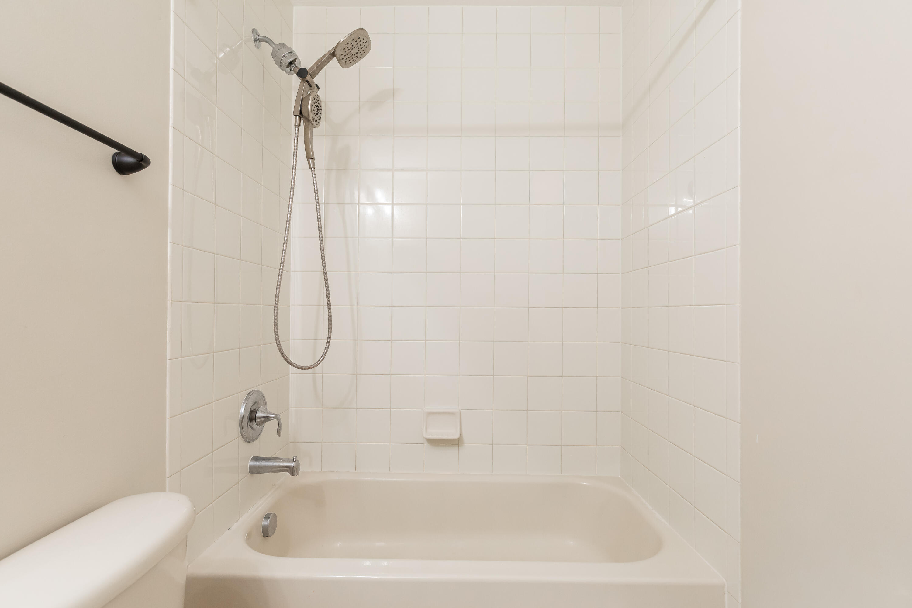 7782 Paddock Place Davie, FL 33328 - Photo 28 of 40 a bathroom with a bath tub with a shower