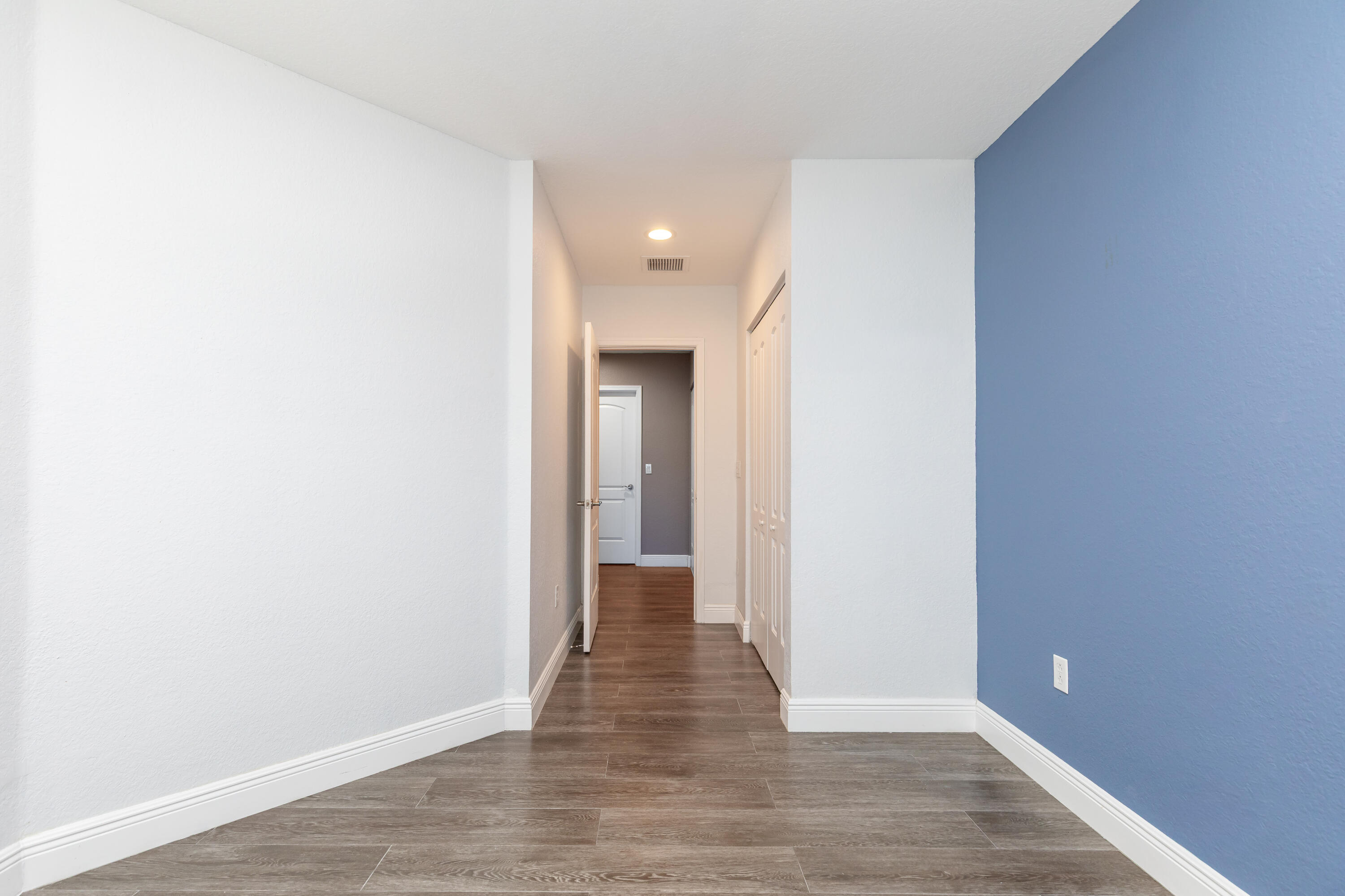 7782 Paddock Place Davie, FL 33328 - Photo 30 of 40 a view of a hallway with wooden floor