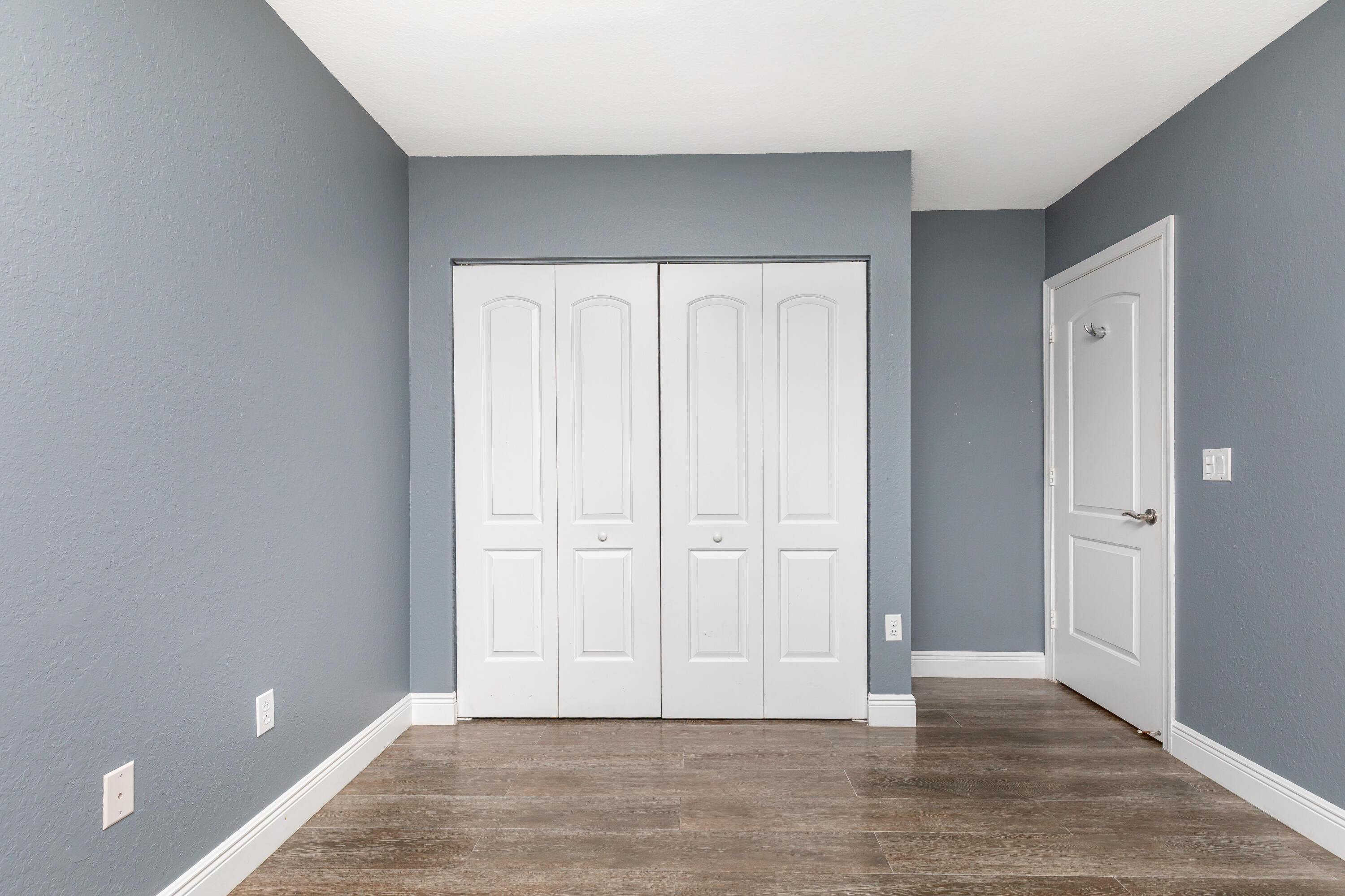 7782 Paddock Place Davie, FL 33328 - Photo 33 of 40 a view of an empty room and wooden floor