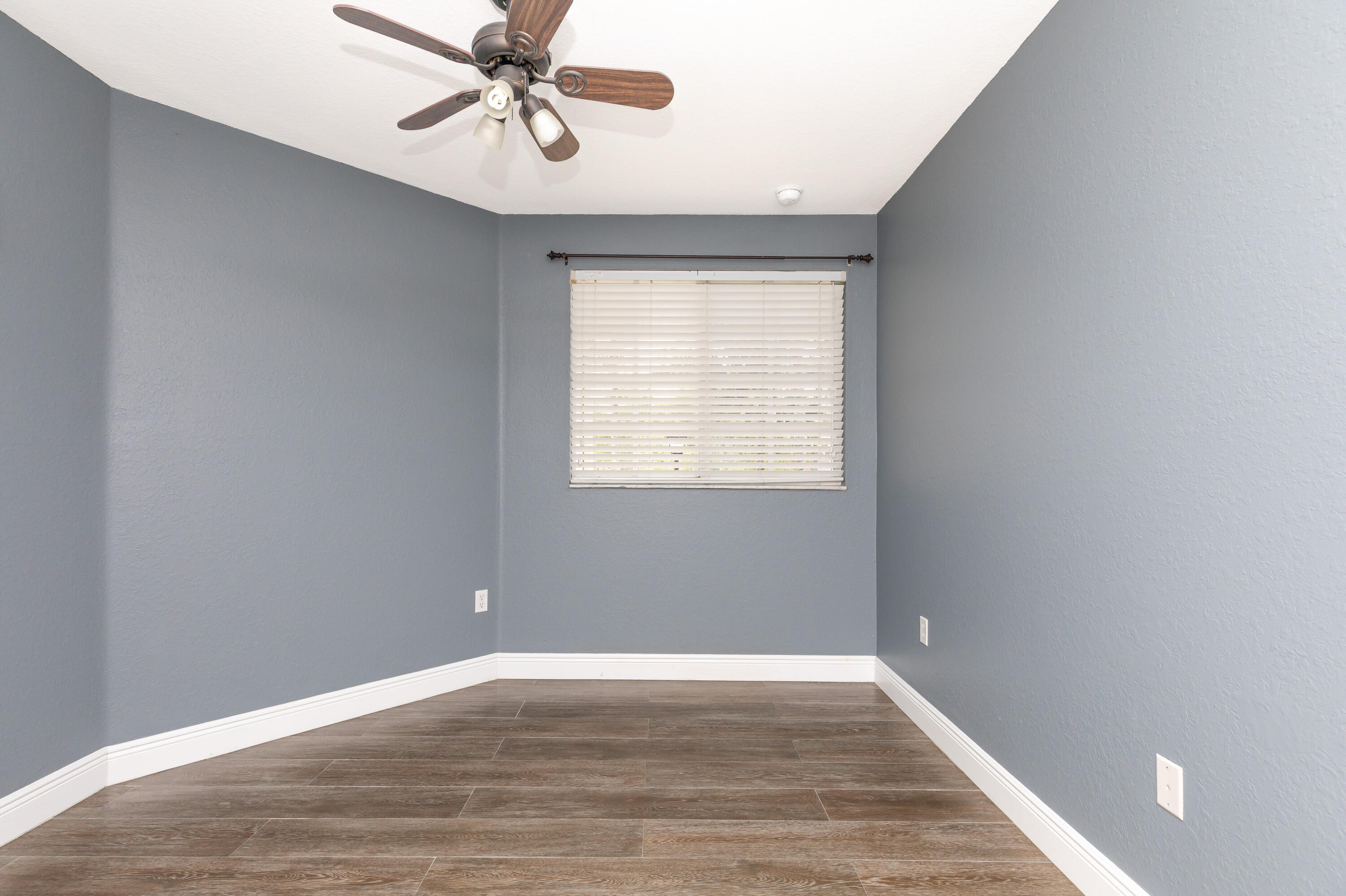7782 Paddock Place Davie, FL 33328 - Photo 34 of 40 wooden floor in an empty room with a window