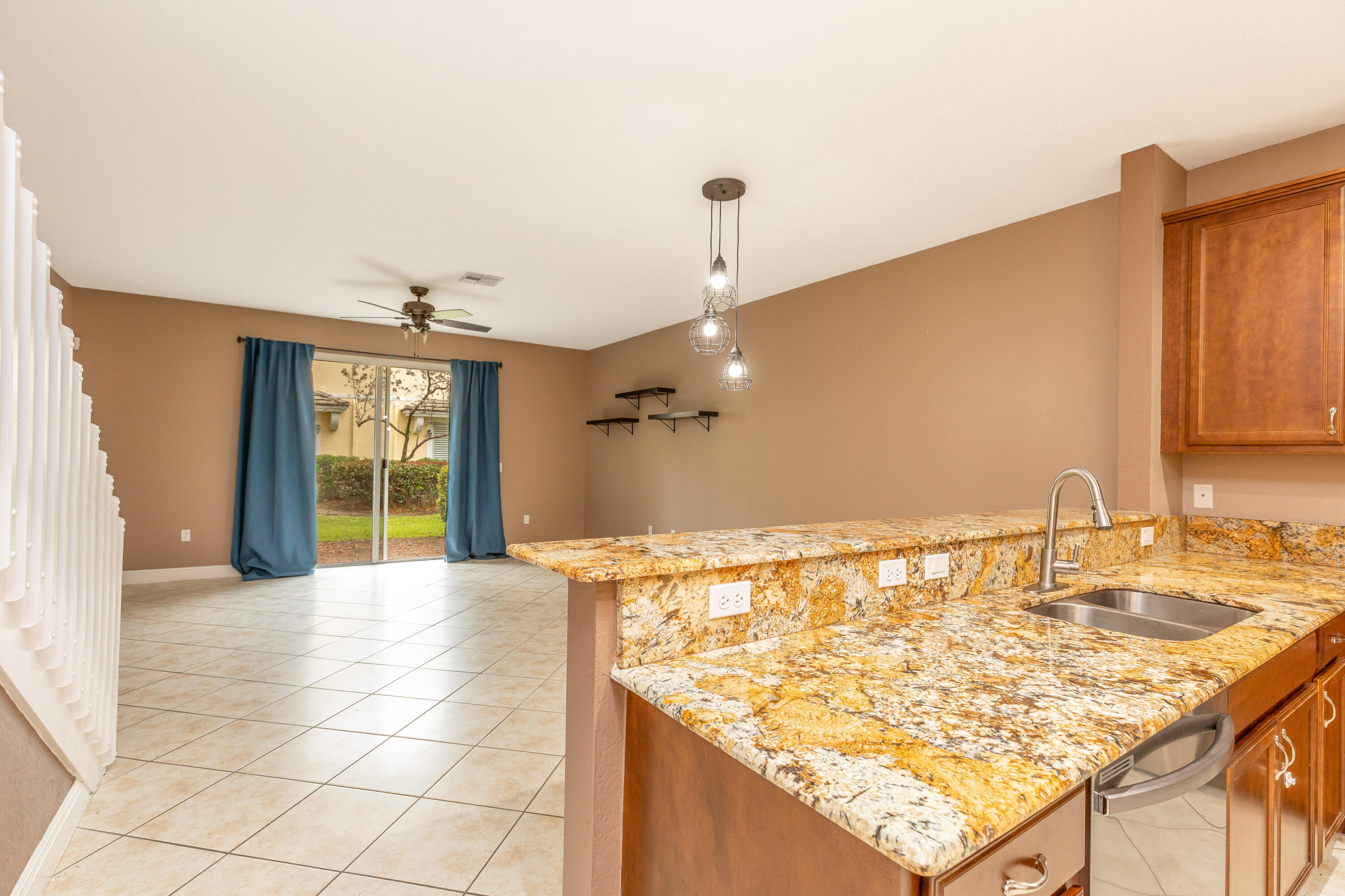 7782 Paddock Place Davie, FL 33328 - Photo 7 of 40 a view of a kitchen with a sink and a wooden floor