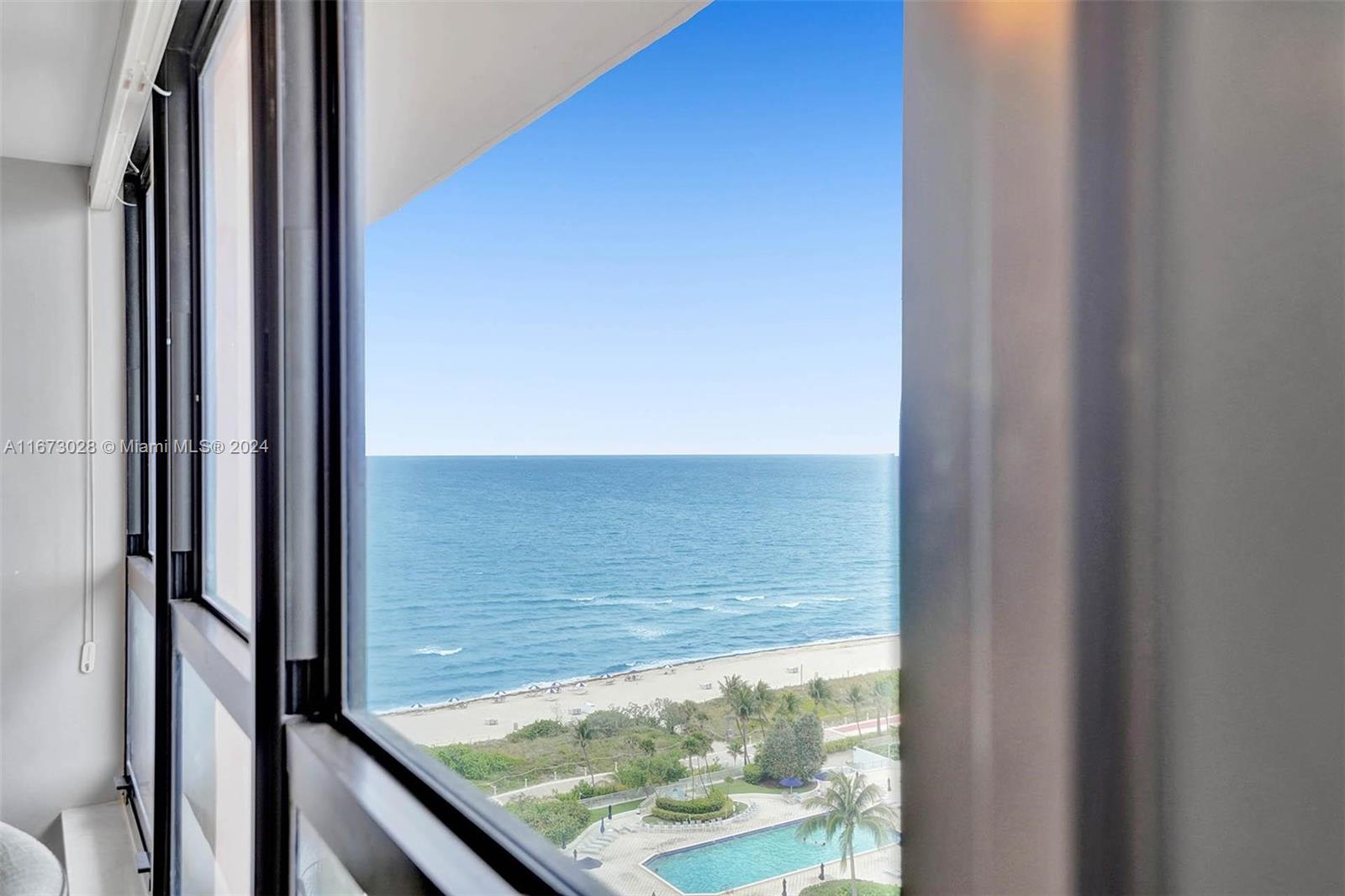 5225 Collins Avenue, Unit PH7 Miami Beach, FL 33140 - Photo 33 of 50 a view of a floor to ceiling window