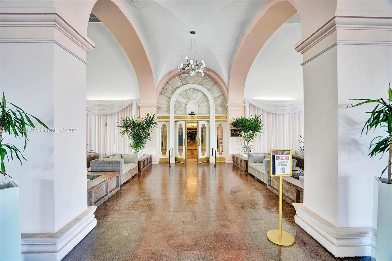 5225 Collins Avenue, Unit PH7 Miami Beach, FL 33140 - Photo 38 of 50 a living room with fireplace furniture and a large window