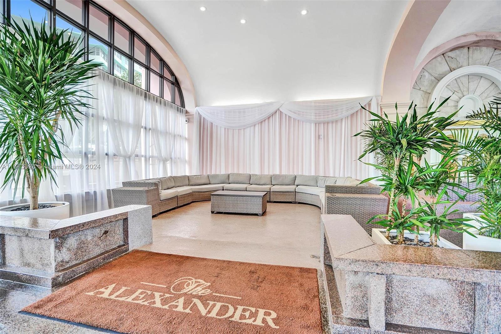 5225 Collins Avenue, Unit PH7 Miami Beach, FL 33140 - Photo 47 of 50 a living room with furniture and a potted plant