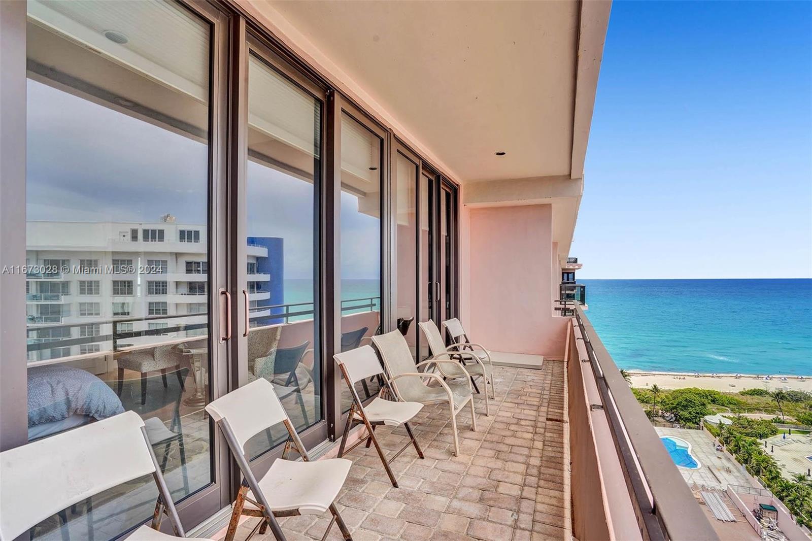 5225 Collins Avenue, Unit PH7 Miami Beach, FL 33140 - Photo 5 of 50 a view of a chairs and table in the balcony