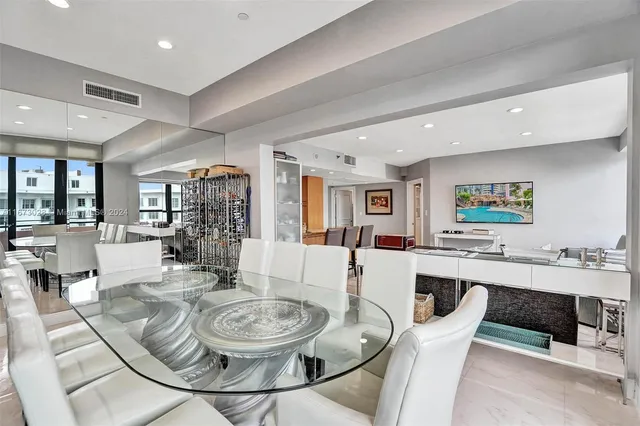 a view of a dining room with furniture and a livingroom
