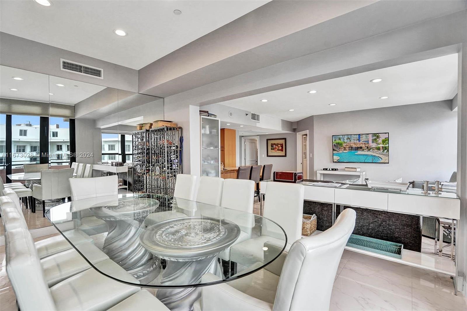 5225 Collins Avenue, Unit PH7 Miami Beach, FL 33140 - Photo 10 of 50 a view of a dining room with furniture and a livingroom