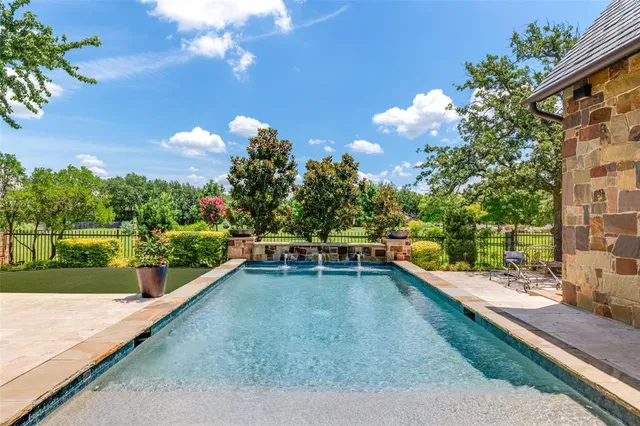 a view of a swimming pool with a patio