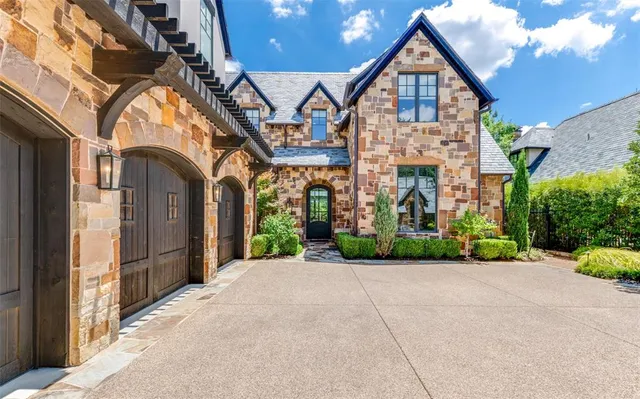 a view of a big house with large windows