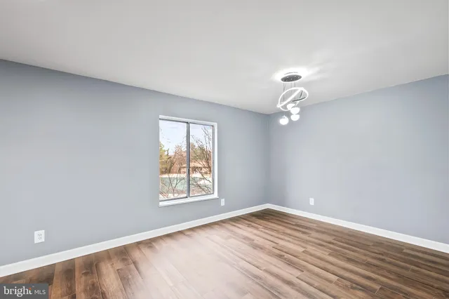 a kitchen with stainless steel appliances granite countertop a refrigerator and a stove