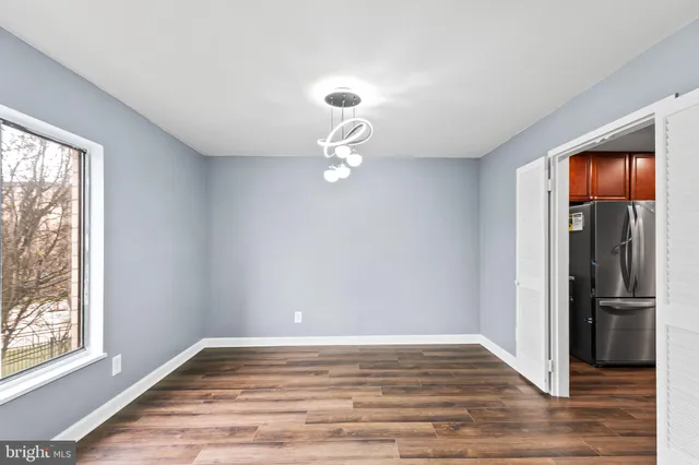 a kitchen with stainless steel appliances granite countertop wooden cabinets stove top oven and sink