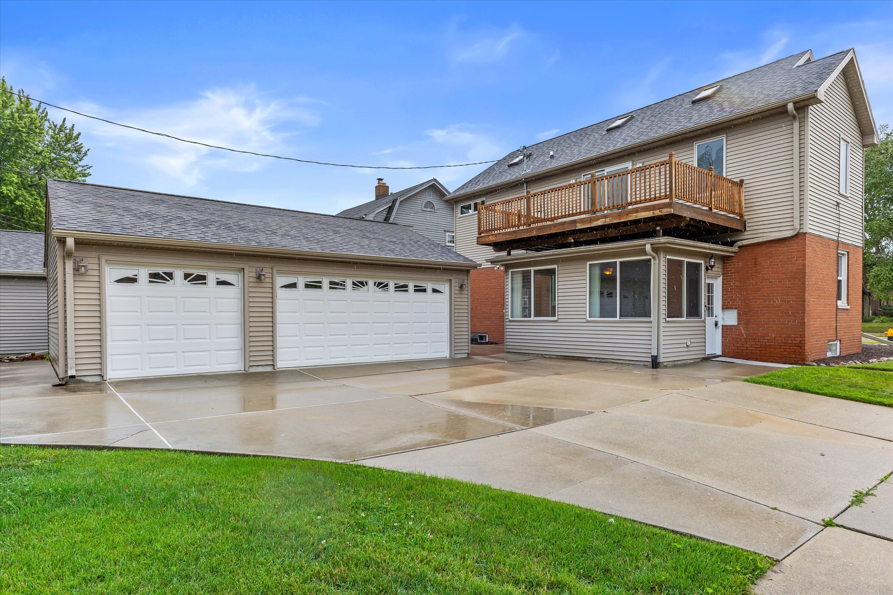 2925 North Main Street Racine, WI 53402 - Photo 16 of 23 Appreciate the home's generous footprint, oversized detached garage, expansive upper deck, and beautifully maintained corner lot.