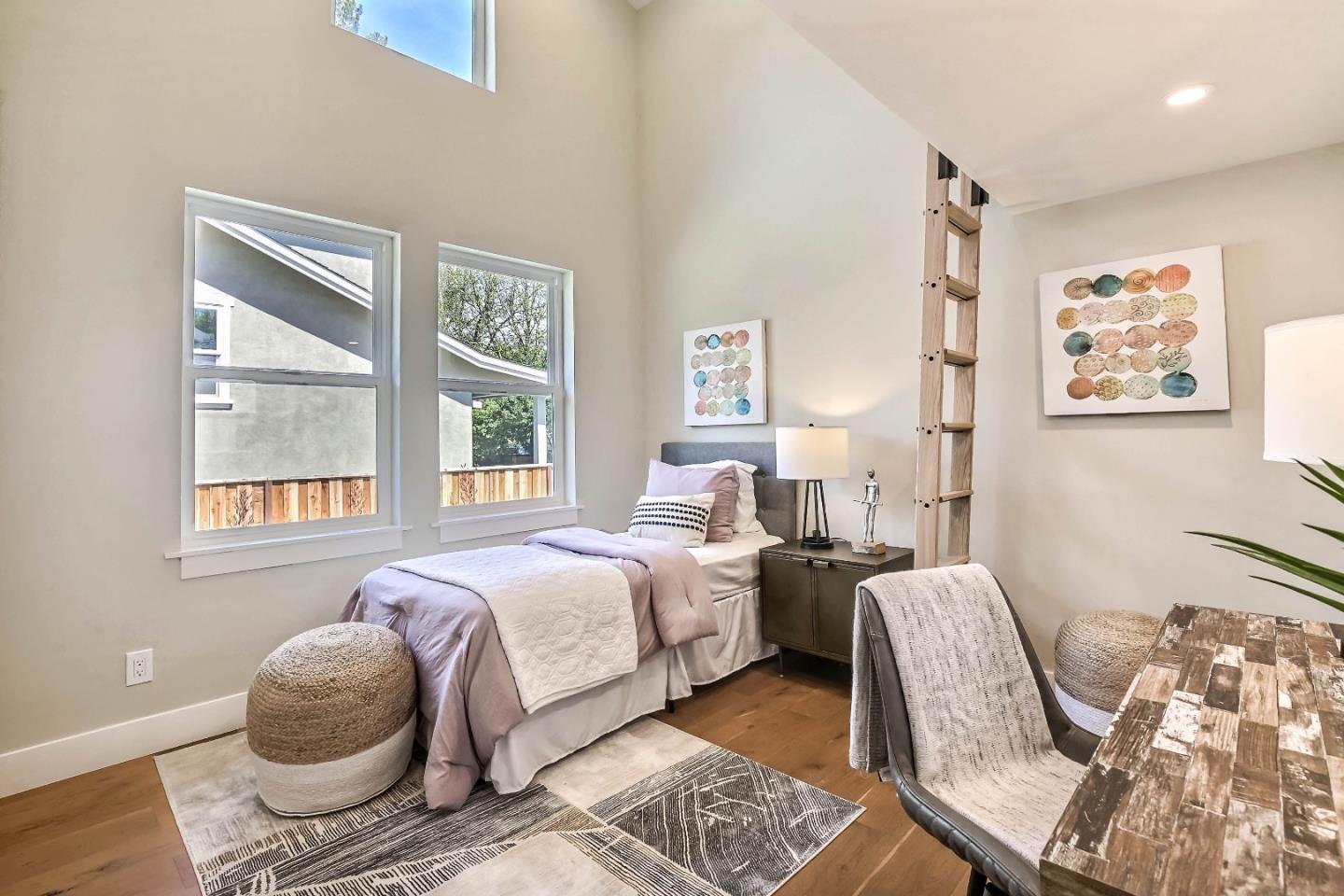267 Willow Road Menlo Park, CA 94025 - Photo 12 of 24 a bedroom with a bed and wooden floor