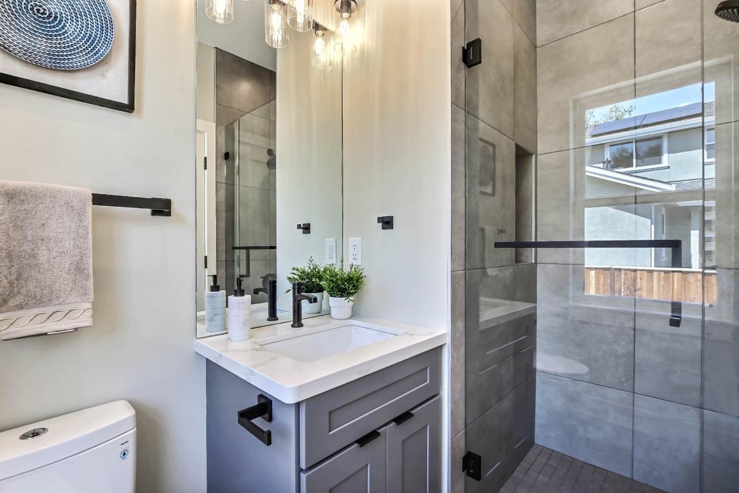 267 Willow Road Menlo Park, CA 94025 - Photo 13 of 24 a kitchen with a sink a refrigerator and cabinets