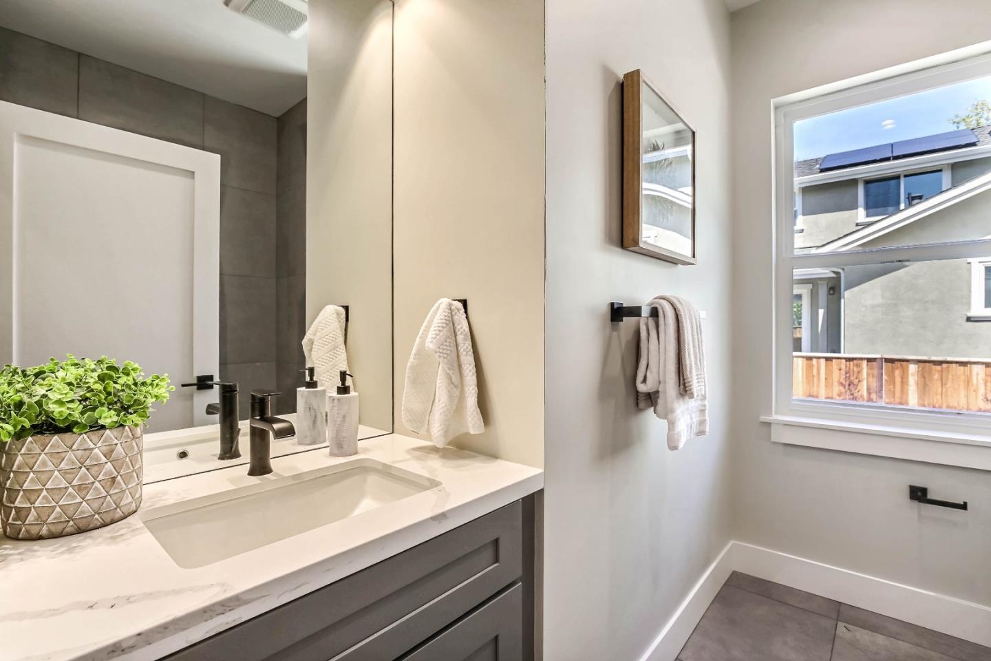 267 Willow Road Menlo Park, CA 94025 - Photo 14 of 24 a bathroom with a sink and a mirror