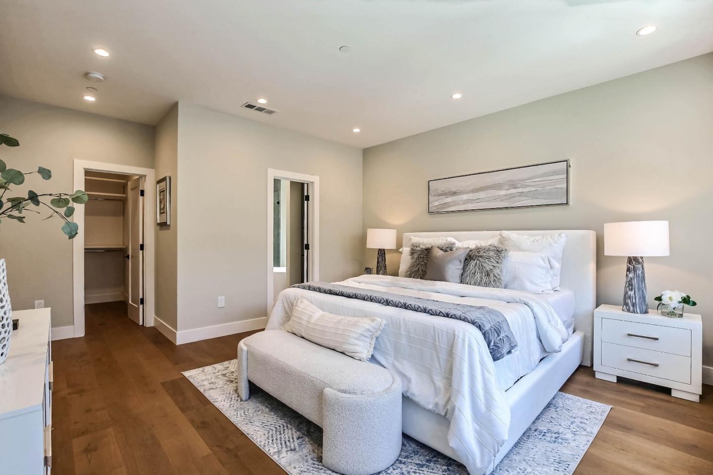 267 Willow Road Menlo Park, CA 94025 - Photo 18 of 24 a spacious bedroom with a bed and a couch