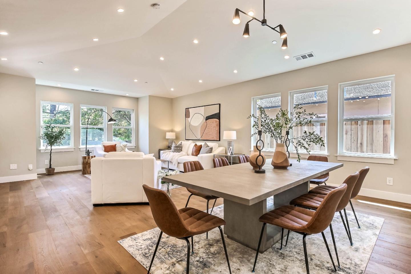 267 Willow Road Menlo Park, CA 94025 - Photo 5 of 24 a view of a dining room with furniture wooden floor and a chandelier