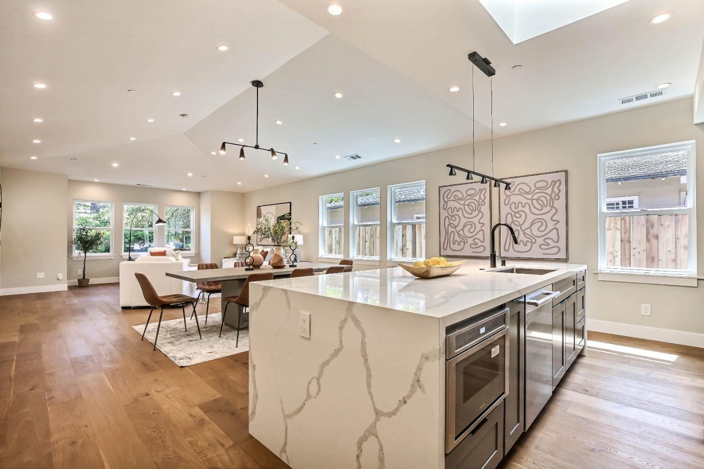 267 Willow Road Menlo Park, CA 94025 - Photo 8 of 24 a kitchen with stainless steel appliances granite countertop a stove and a wooden floors