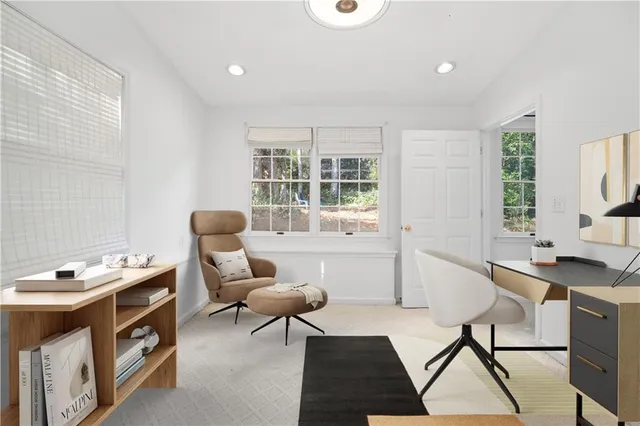 a workspace with furniture and window