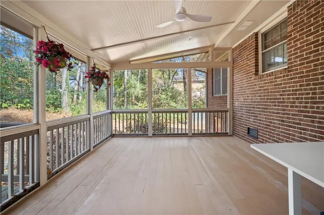 a view of a porch with wooden floor